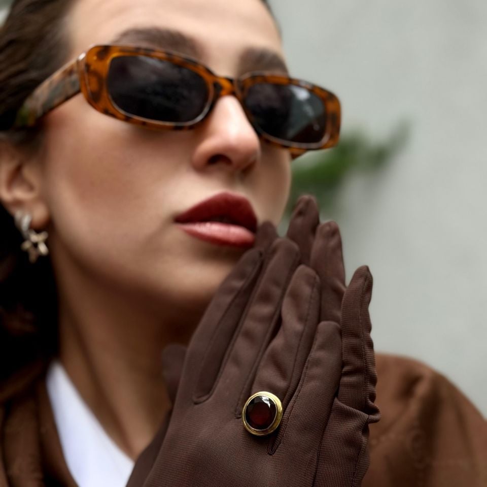 GOLD PLATED SILVER RING WITH RUBY STONE.
